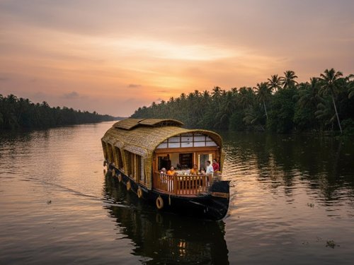 family Houseboat booking Traditional Kerala houseboat cruising through Kumarakom